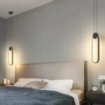 2 LED-Pendelleuchte mit minimalistischem Design, oval, schwarz, über zwei Nachttischen um ein Bett herum